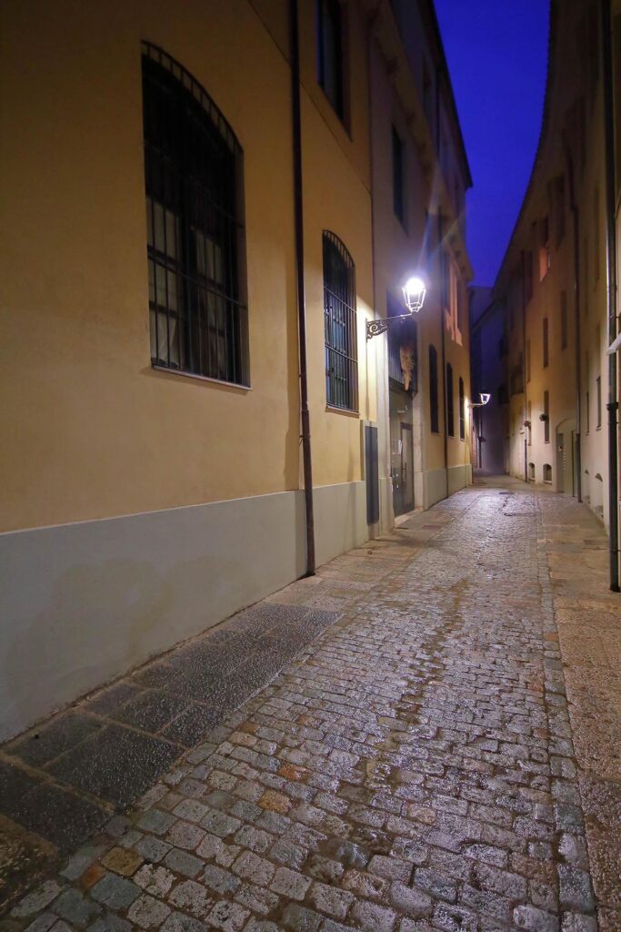 Night view of Carrer de la Rosa with the entrance to the apartment